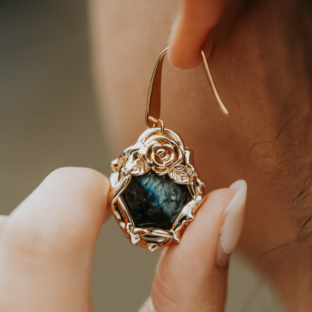woman wearing labradorite earrings