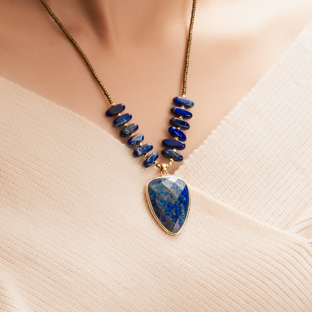 woman wearing blue lapis necklace