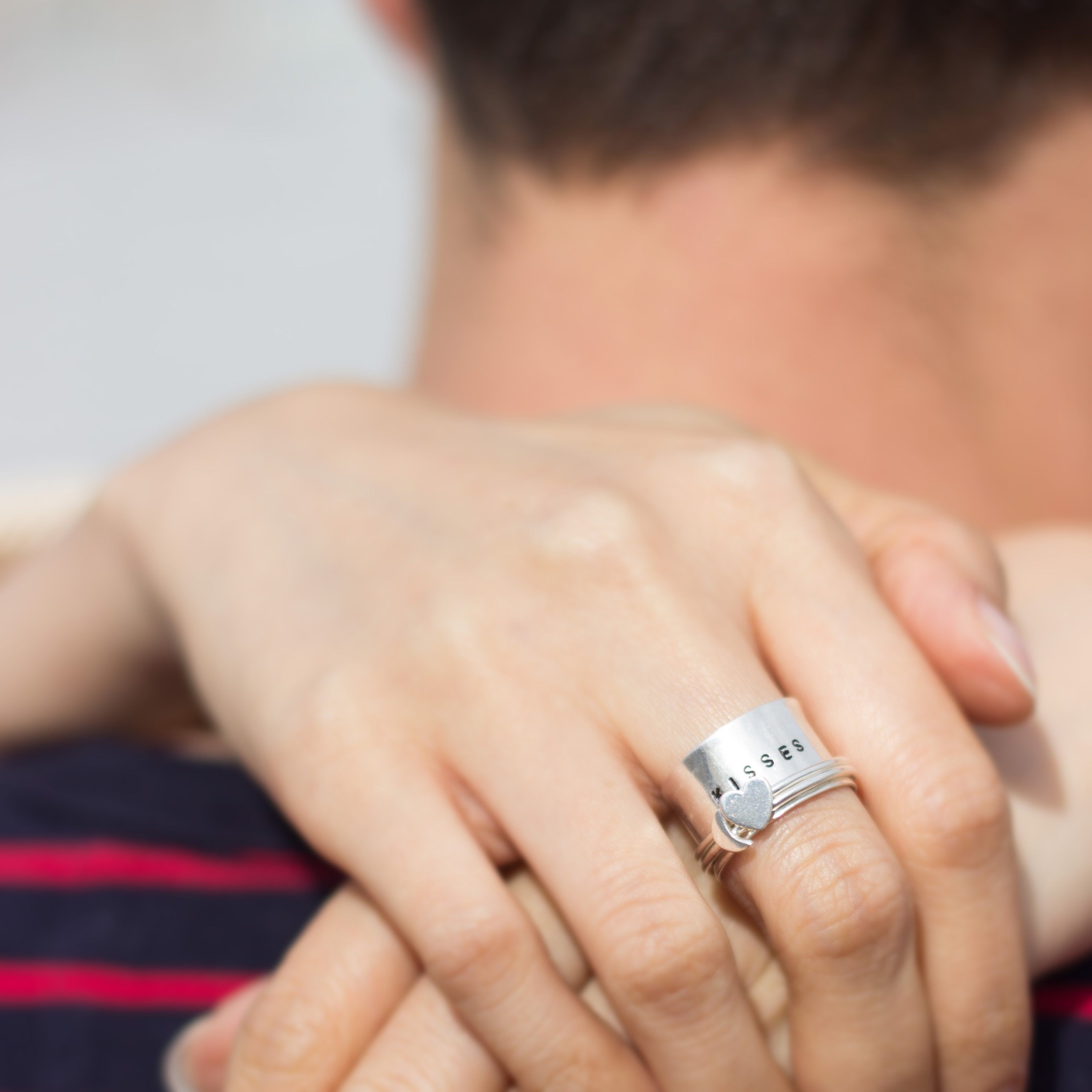 woman wearing heart spinner ring