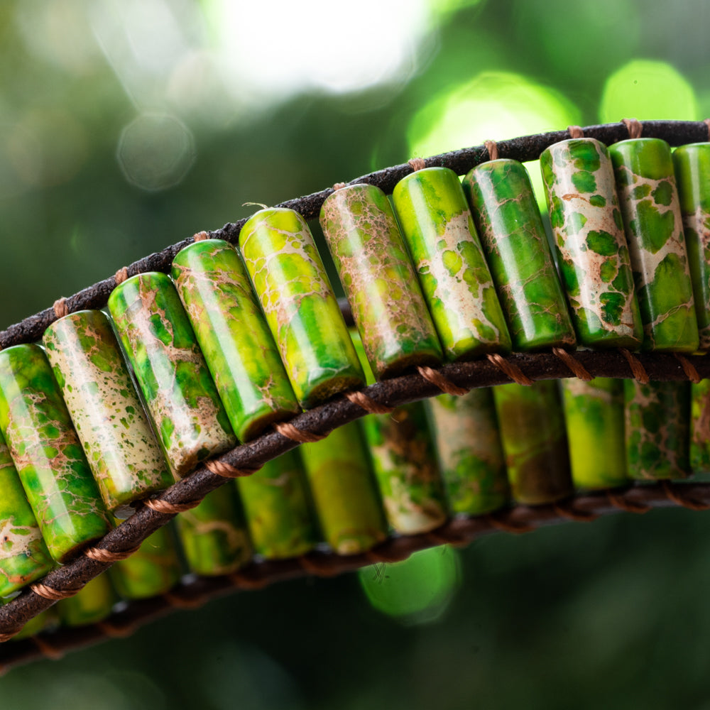 Make a statement with this unique leather wrap bracelet adorned with tube-shaped green Jasper stones.