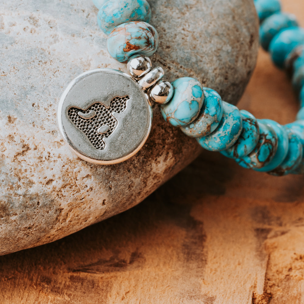 Handmade Meditation bracelet with healing turquoise stone beads and a silver buddha charm by Treehut