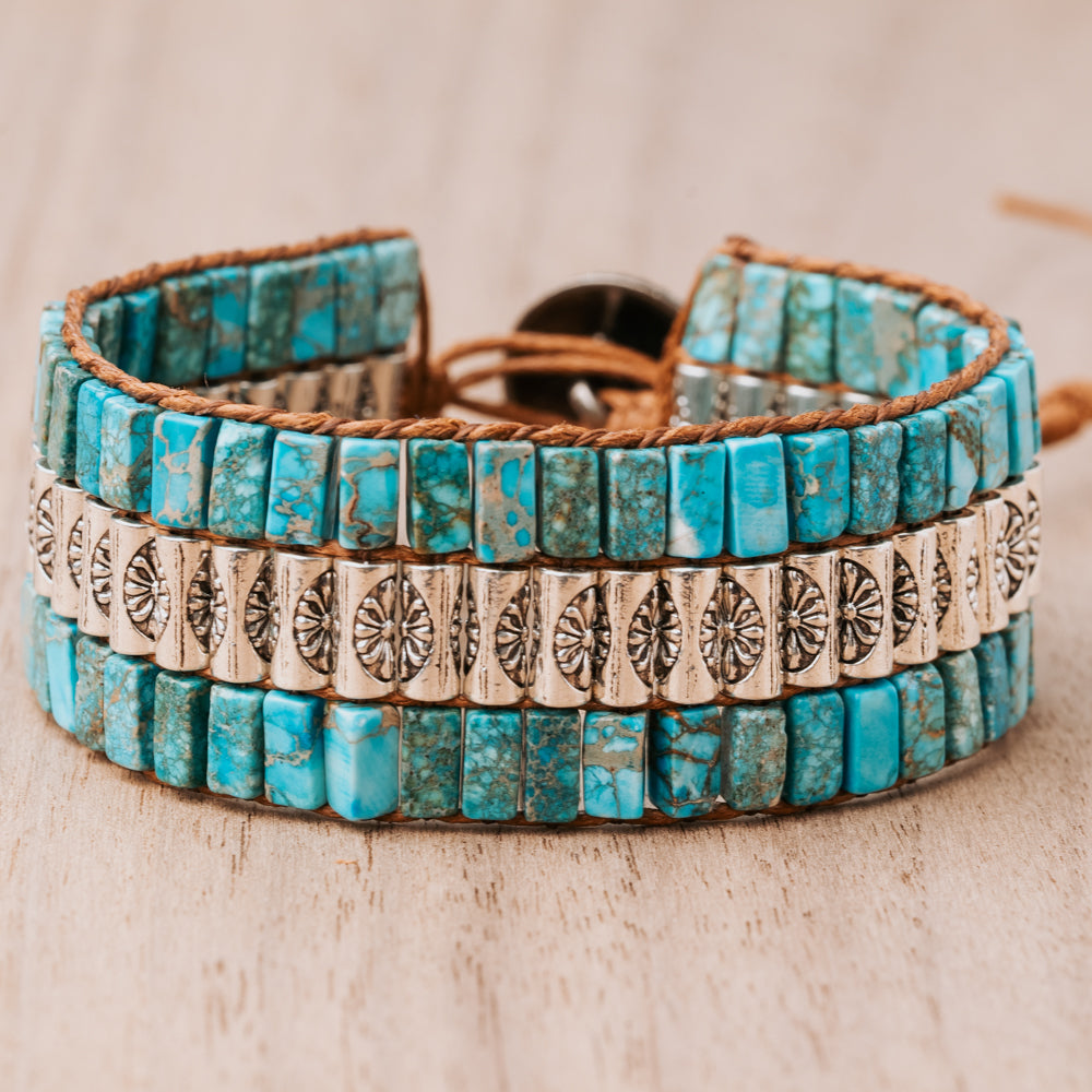 Treehut cuff style bracelet with natural blue turquoise stones & engraved silver beads. Adjustable between 6-8". Laid-back yet chic design. Made with genuine leather.