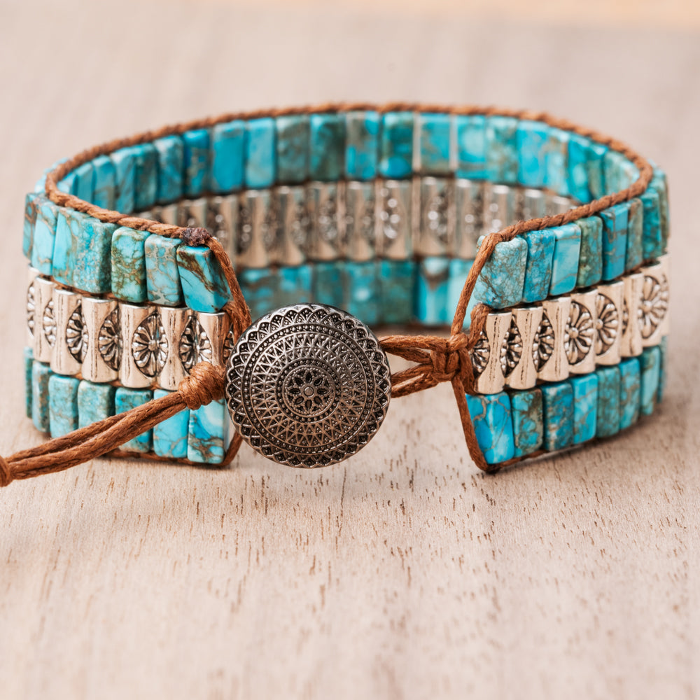 Treehut women's cuff bracelet made with blue turquoise tube stones and genuine leather straps.