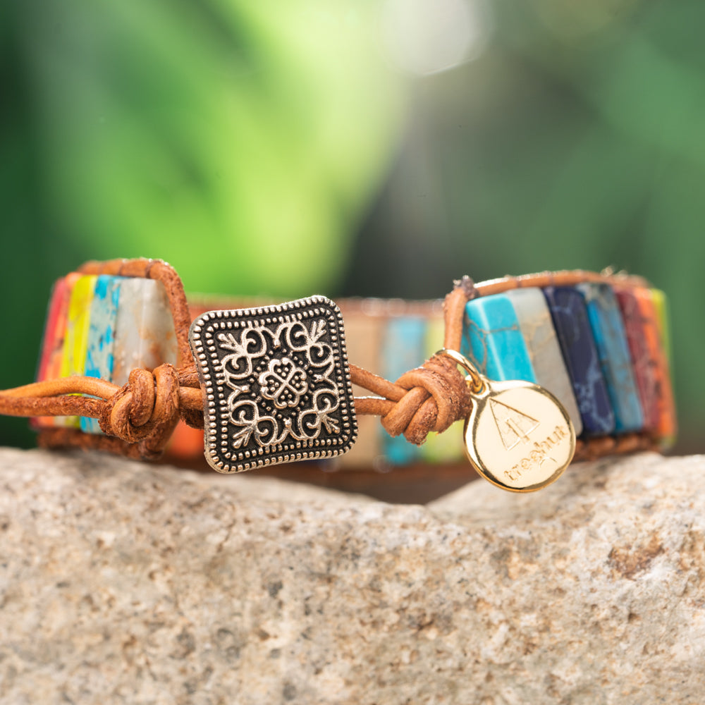 Experience the beauty and diversity of natural jasper stones with this unique single wrap bracelet featuring imperial jasper stones in all seven colors.