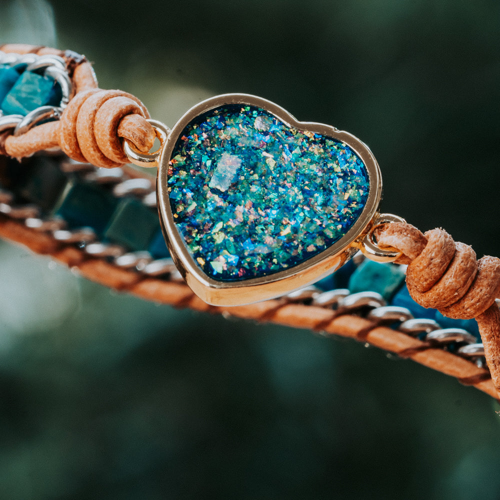 heart shaped handcut blue opal stone in a three leather wrap bracelet handmade by Treehut