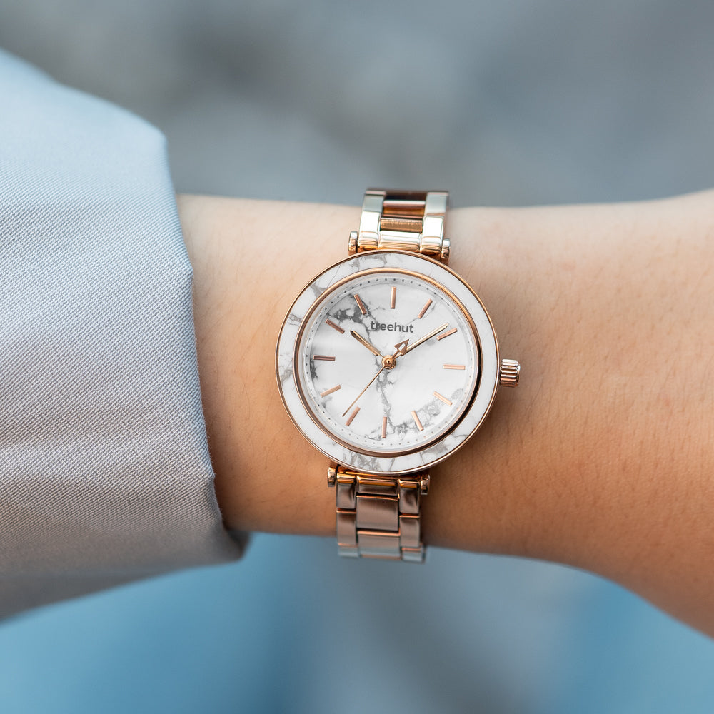 woman wearing white dial watch
