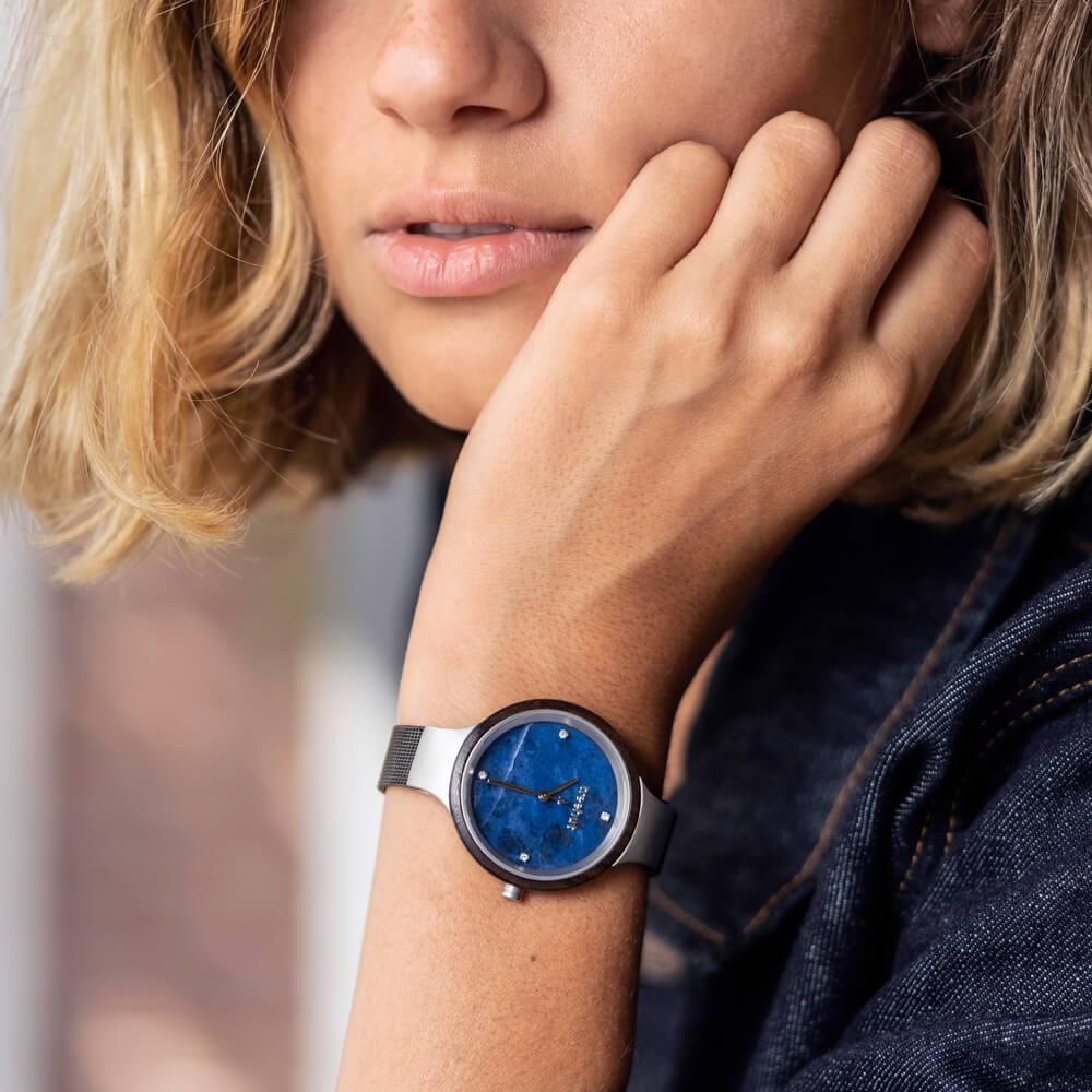 woman wearing blue marble watch