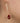 woman wearing red stone earrings