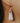 woman wearing white & gold stone earrings