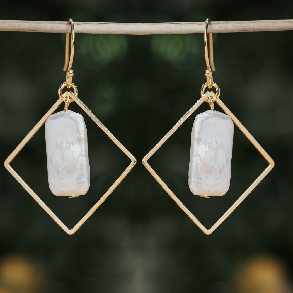 White and gold shell earrings