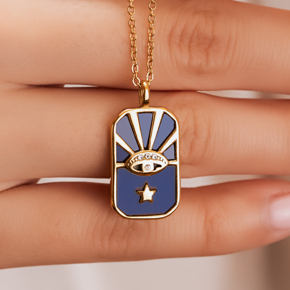 woman holding evil eye necklace