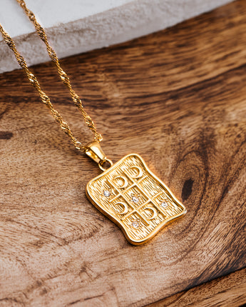Gold tic tac toe pendant with cubic zirconias and moons