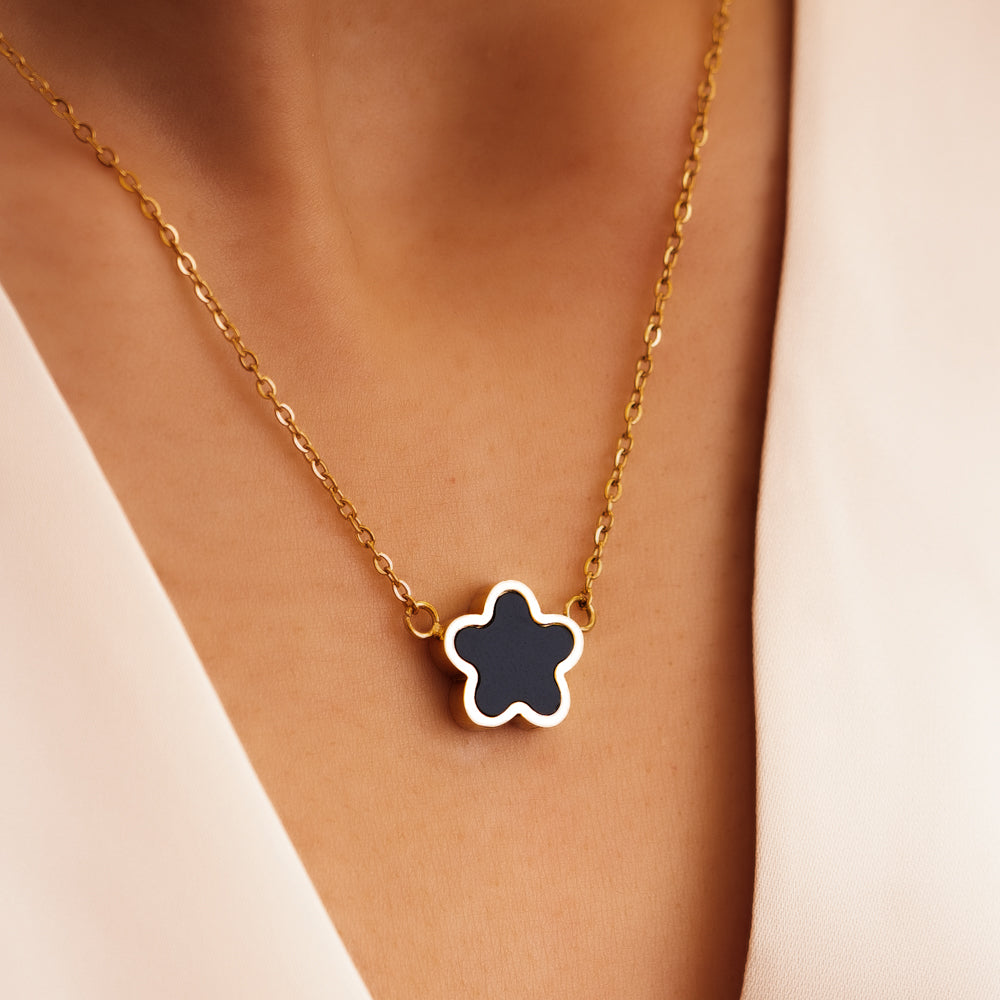 Flower shaped black and gold necklace