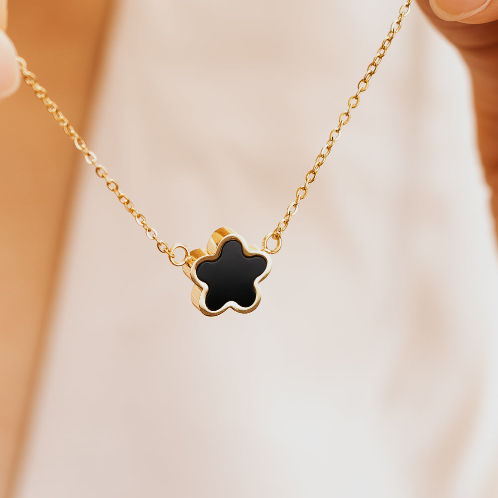 Flower shaped black and gold necklace