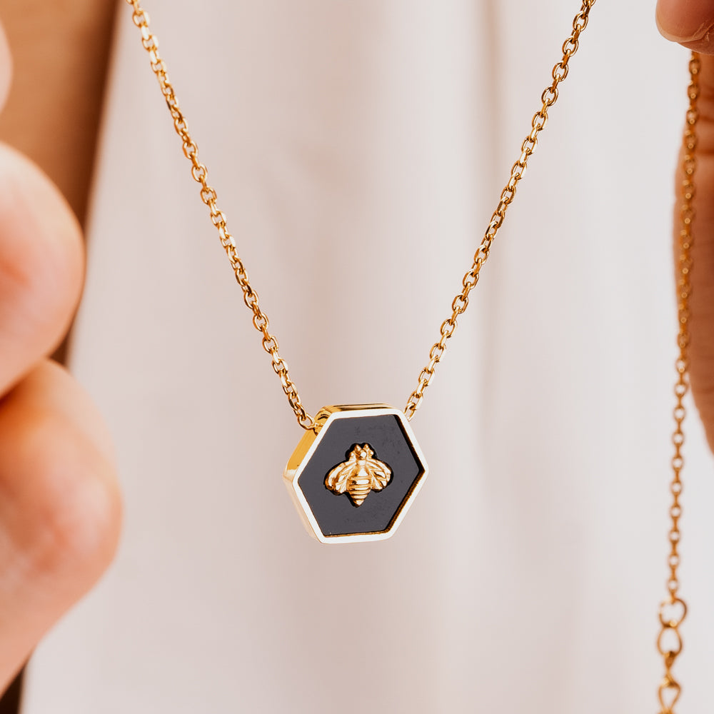 Black and gold black shell necklace with gold cable chain