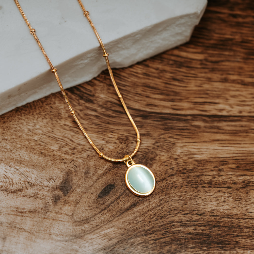 Gold and mint green opal stone pendant necklace with snake and ball chain