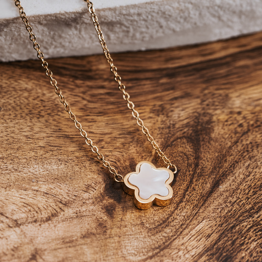 gold and white flower necklace