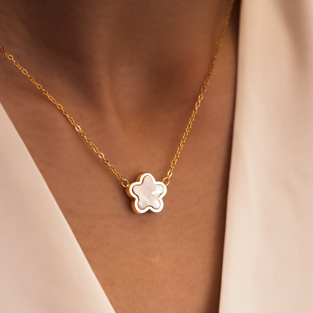 woman wearing white flower necklace