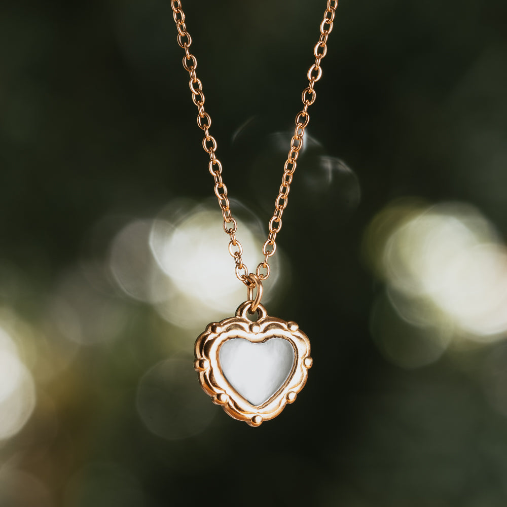 White and gold heart-shaped necklace with gold plated chain