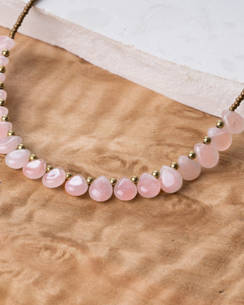 Light pink rose quartz natural stone necklace with teardrop shaped beads and gold details for women 
