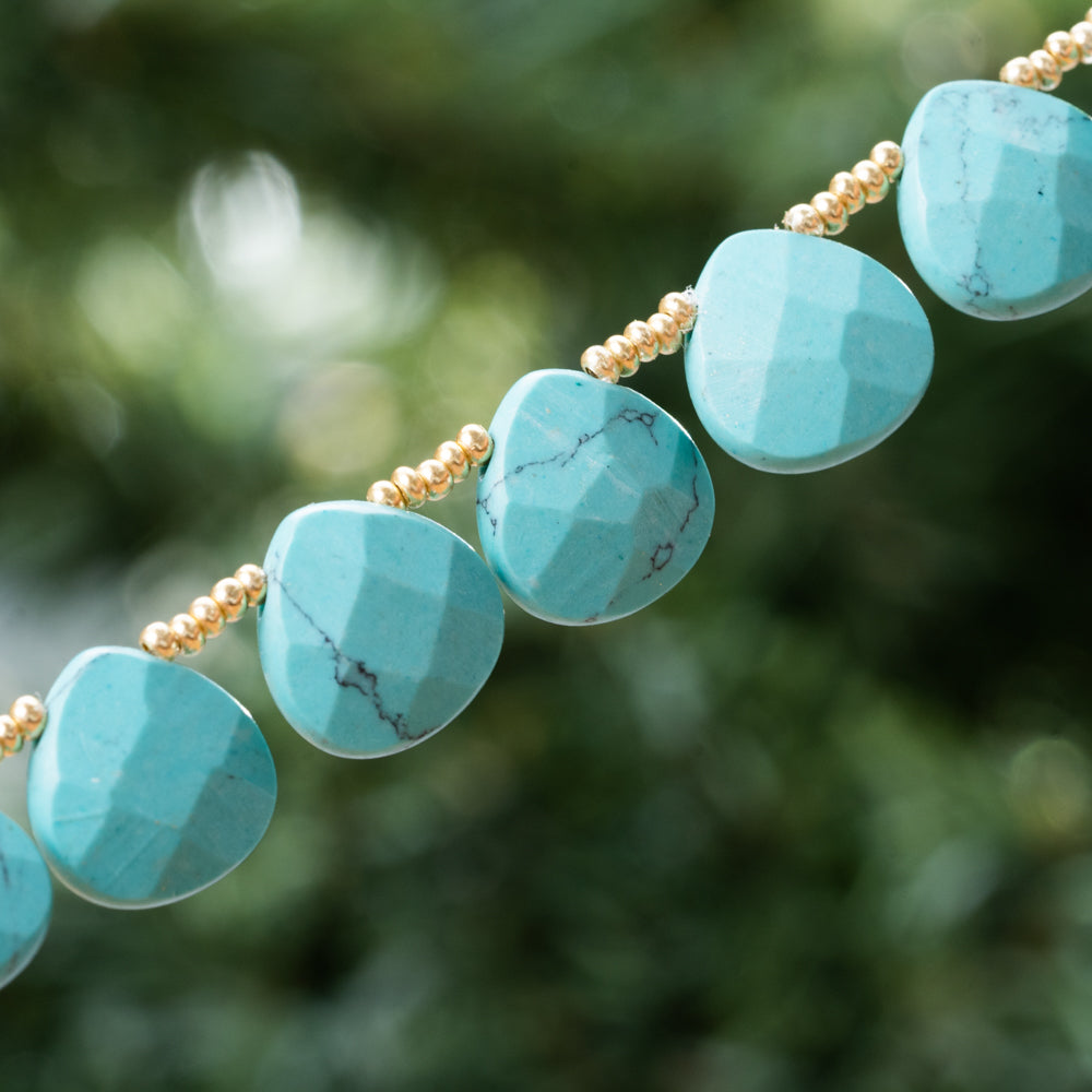 Handmade blue turquoise natural stone necklace with gold details. The perfect natural stone jewelry for women