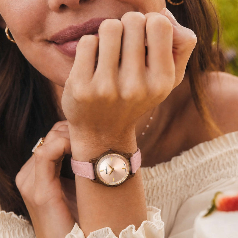 woman wearing a women’s wooden watch with pink leather strap