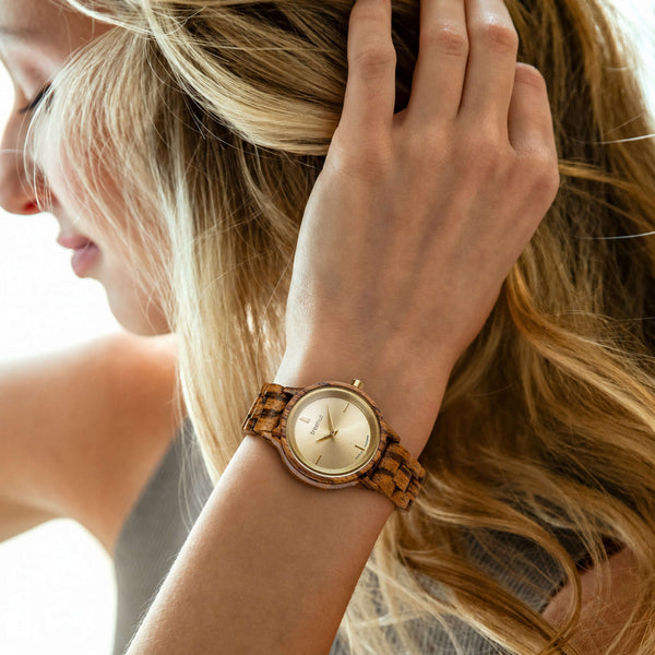 woman wearing a women’s wooden watch