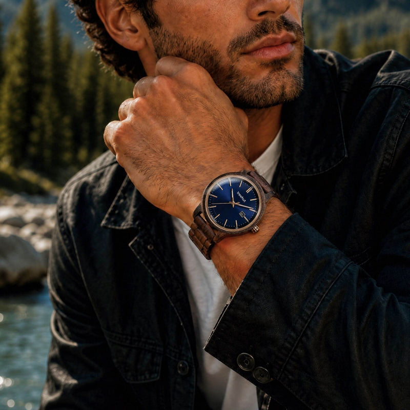 man wearing an ebony wood watch with blue dial