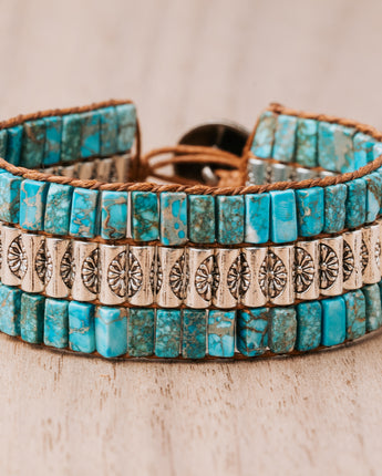 Treehut cuff style bracelet with natural blue turquoise stones & engraved silver beads. Adjustable between 6-8". Laid-back yet chic design. Made with genuine leather.