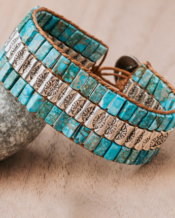Turquoise & silver beaded leather cuff. Adjustable between 6-8". Stylish & comfortable. Made with genuine leather for a perfect fit