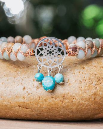 This single wrap bracelet is made from natural Amazonite and blue Jasper stones, carefully beaded together with leather strips for a unique look