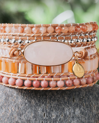 Pink and orange natural stone five leather wrap bracelet with rose quartz crystal and rhodonite stone beads. 