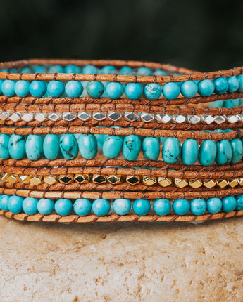 Treehut five-wrap bracelet is a true masterpiece, showcasing the natural beauty of Turquoise stone and Sterling Silver on genuine leather straps
