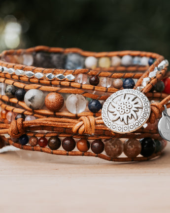 Red, black, white, silver natural stones, jasper stones and leather straps make up a great bracelet 
