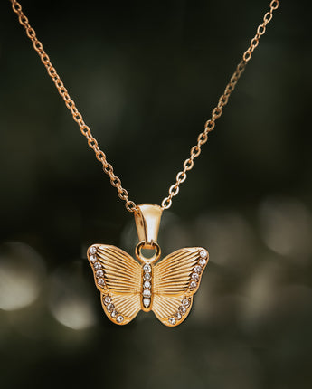 Engraved gold butterfly pendant handmade with cubic zirconia detailing