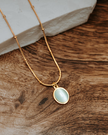 Gold and mint green opal stone pendant necklace with snake and ball chain 